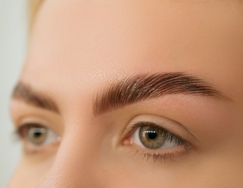 womans eyebrows after receiving treatment