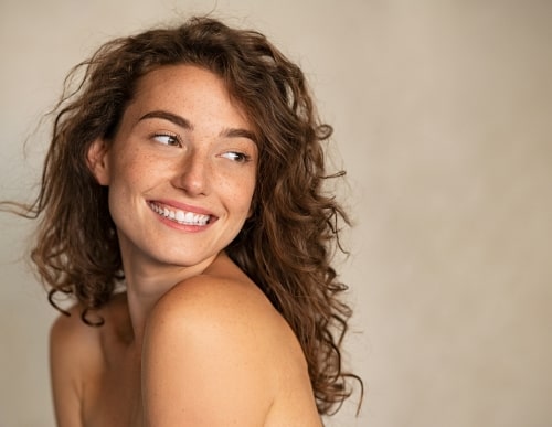 young woman with nice skin smiling